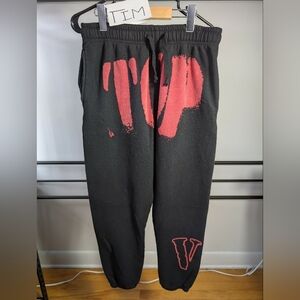 Black Sweatpants with Red Graphic 'V'